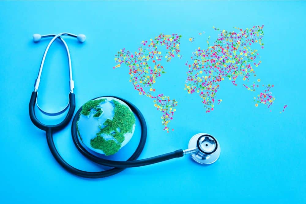 Left side: A stethoscope wrapped around a small globe of the Earth representing planetary health. Right side: A world map from colourful dots all connected representing collective wisdom.